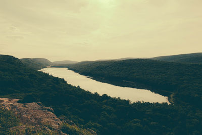 Scenic view of river against sky