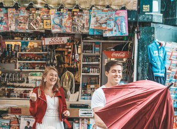 Portrait of smiling young couple in store