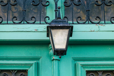 Low angle view of blue metal door