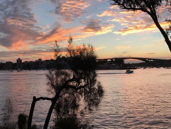 Scenic view of river against sky during sunset