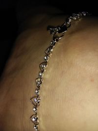 Close-up of hand on chain