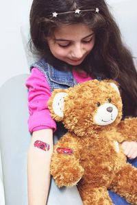 Close-up of cute girl with stuffed toy