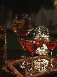 Close-up of red drink in glasses on table