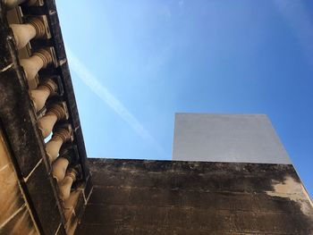 Low angle view of building against blue sky