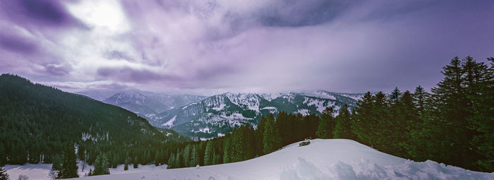 Scenic view of snowcapped mountains against sky