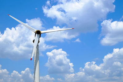 Low angle view of wind turbine against sky