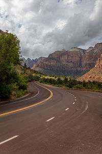 Empty road against sky