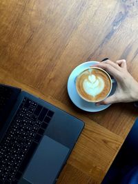 High angle view of coffee cup on table