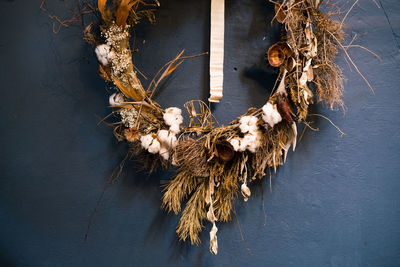 Close-up of wilted hanging on wall