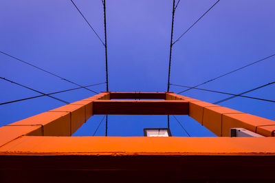 Low angle view of golden gate bridge against clear blue sky