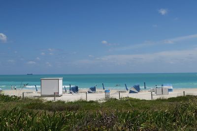 Scenic view of sea against blue sky