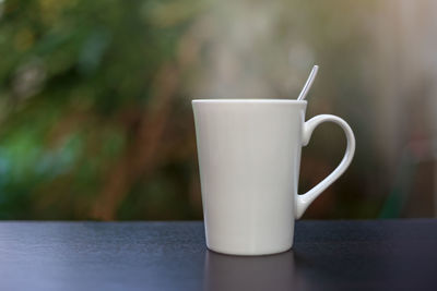 Close-up of coffee cup on table