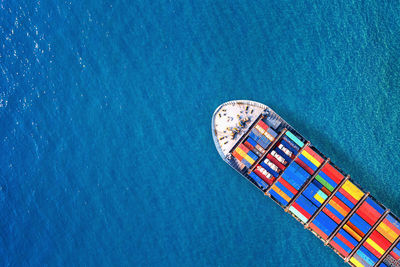 Aerial view of cargo containers in ship on sea