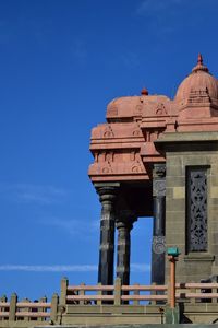 Low angle view of historical building against blue sky