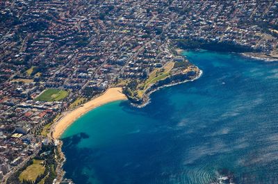 High angle view of city on sea
