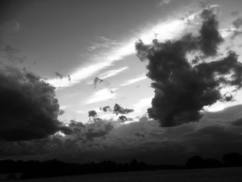 Low angle view of silhouette trees against sky during sunset