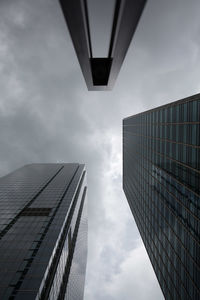 Low angle view of building against cloudy sky
