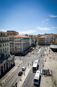 High angle view of street by buildings in city