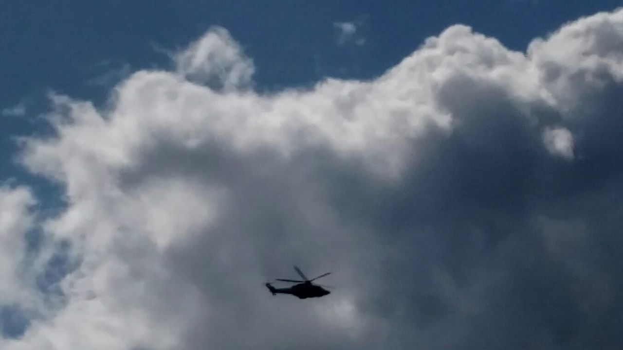 flying, low angle view, transportation, mode of transport, airplane, sky, air vehicle, mid-air, cloud - sky, on the move, cloudy, silhouette, cloud, travel, journey, nature, helicopter, motion, outdoors, flight