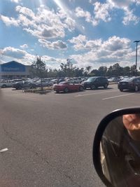 Cars on road against sky