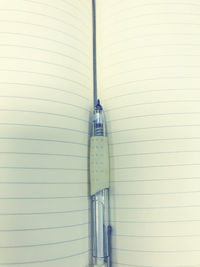 Directly above shot of pen with book