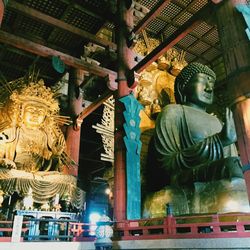 Low angle view of statue against building