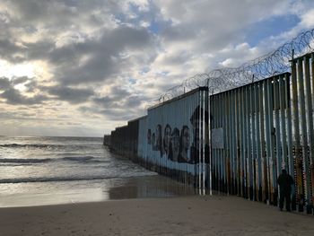 The border wall between mexico and the united states extends into the ocean near tijuana