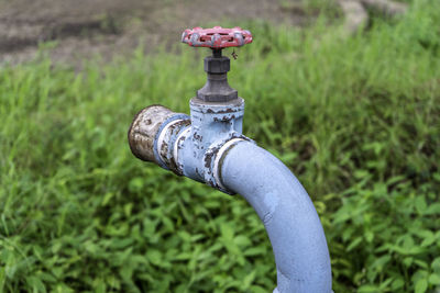 Close-up of fire hydrant on field