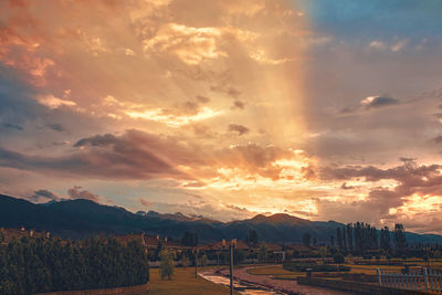 Scenic view of landscape against sky during sunset