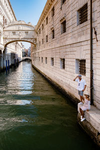 People on bridge over canal