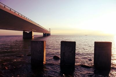 Wooden pier on sea against sky