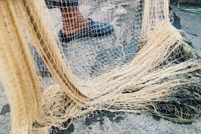 Low section of man with fishing net