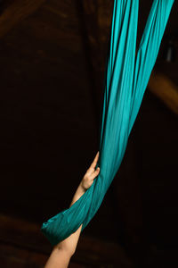 Cropped hand of woman holding rope