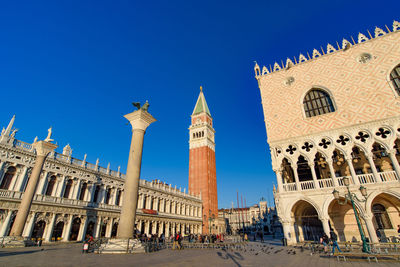 Low angle view of historical building against blue sky