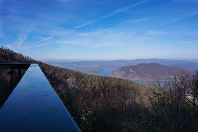 Scenic view of mountains against blue sky