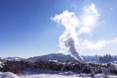Industrial air pollution at beautiful rural nature in winter