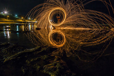 Light painting against sky at night