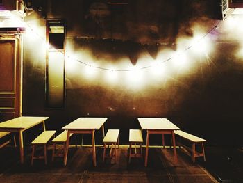 Chairs in illuminated room