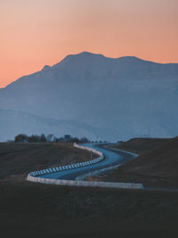 Scenic view of mountains against sky during sunset