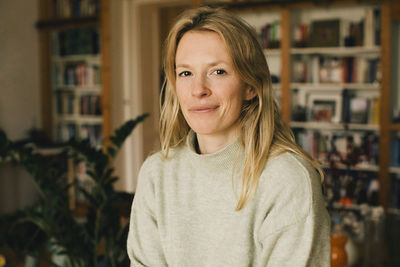 Portrait of blond woman at home