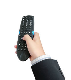 Low angle view of hand using mobile phone against white background