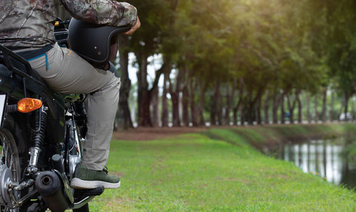 Man riding bicycle on grassland