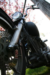 Low angle view of motorcycle against sky