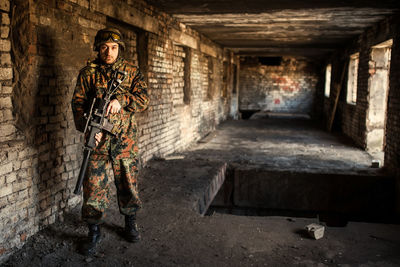 Full length of man standing in abandoned building