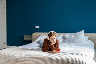 Young woman sleeping on bed at home