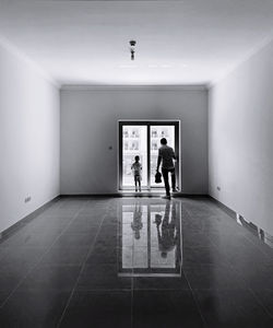 People standing in corridor of building