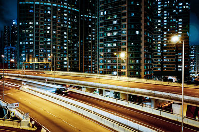 Traffic on highway in city at night