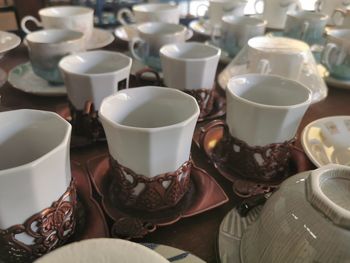 High angle view of coffee cups on table