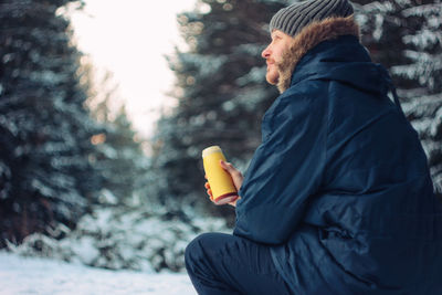 Midsection of person wearing hat during winter