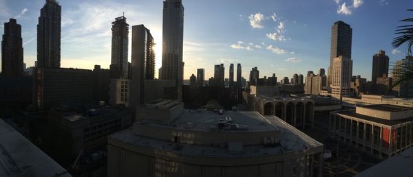 City skyline against cloudy sky